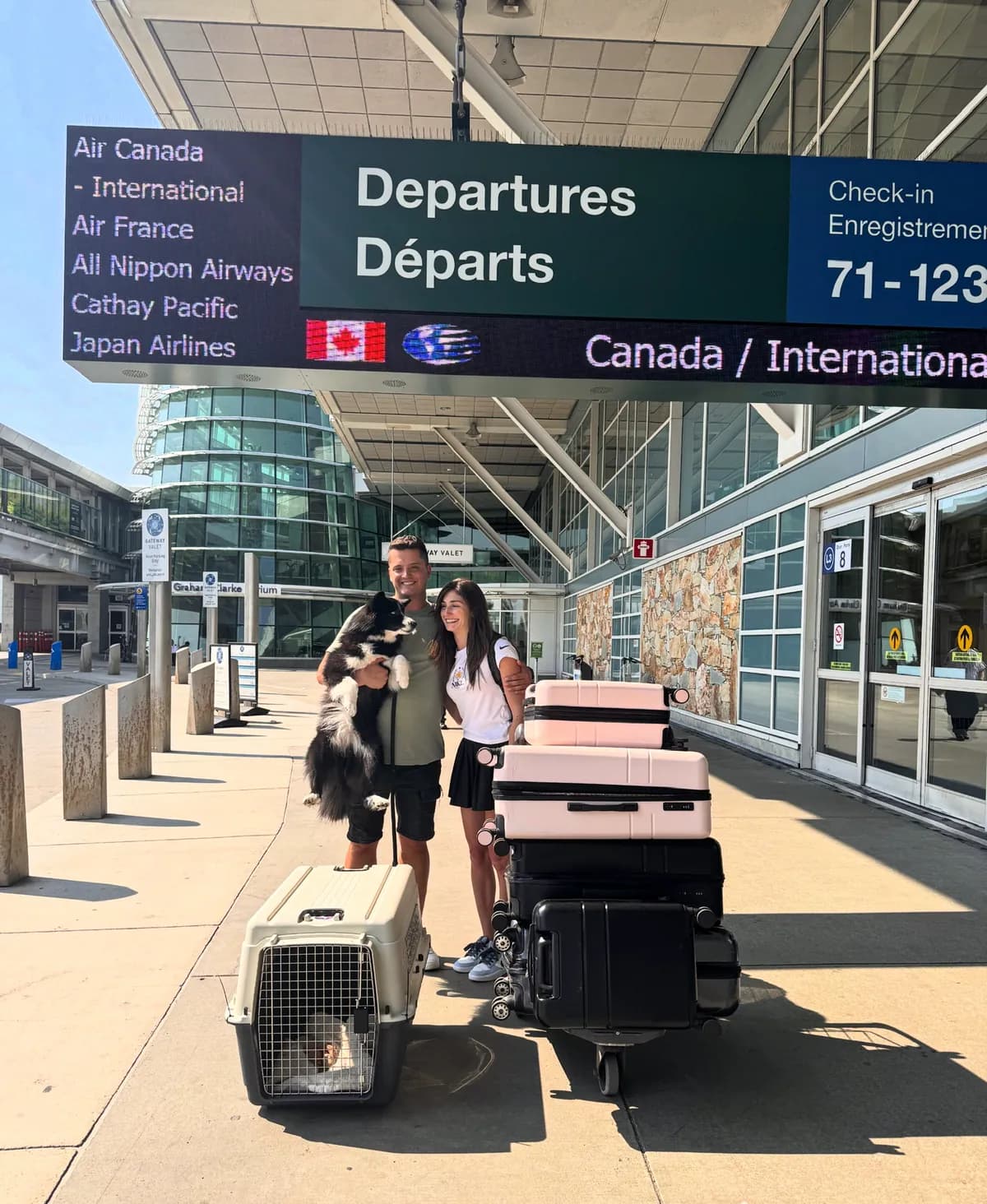 Nik, his girlfriend and their dog at the airport leaving Canada