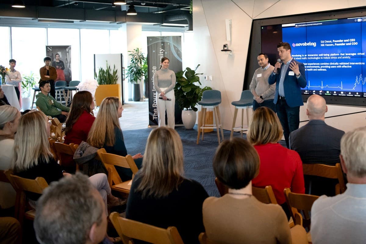 Nik presenting Novobeing at The Roux Institute with Sid Desai.